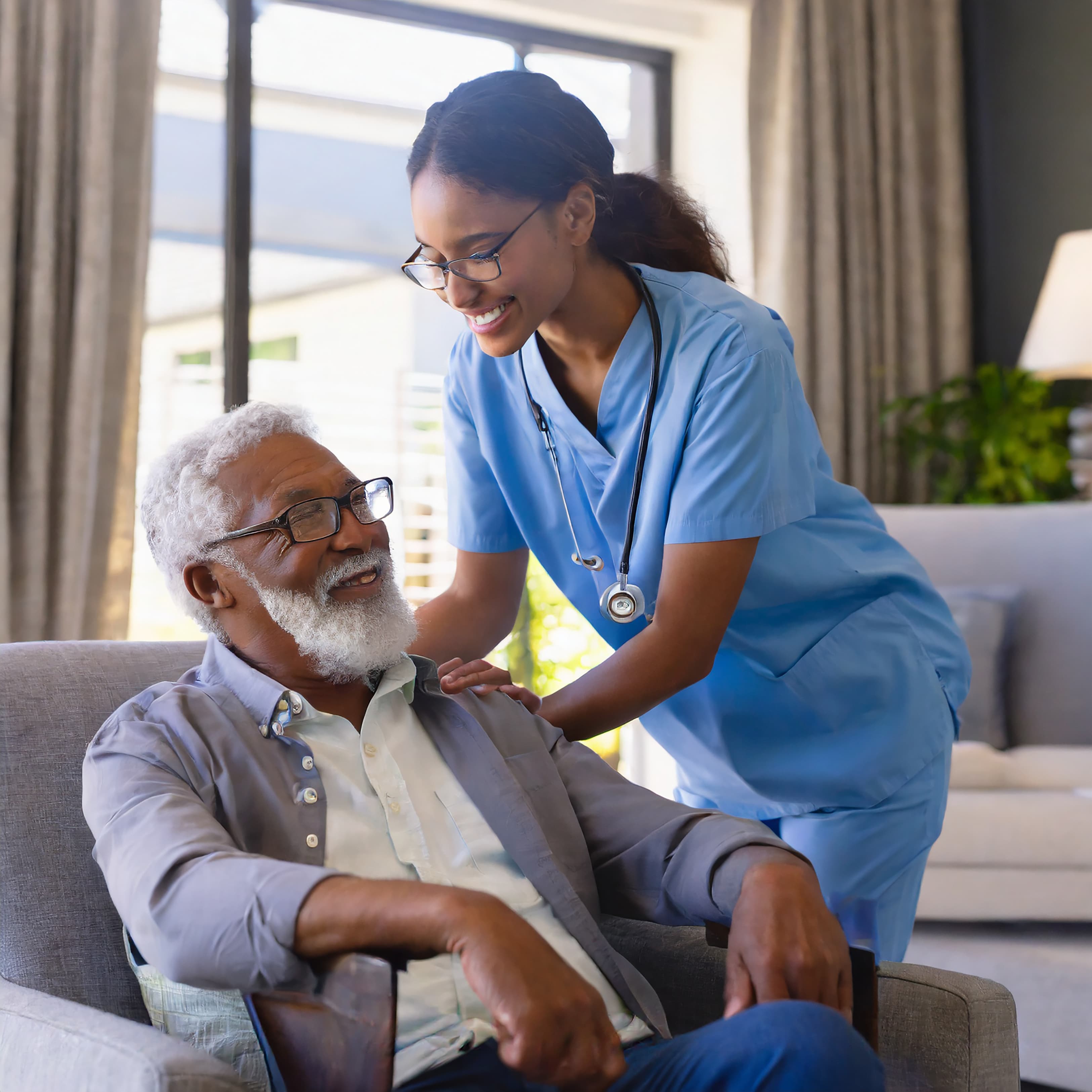 Agape Comfort Care — caregiver with senior client at home